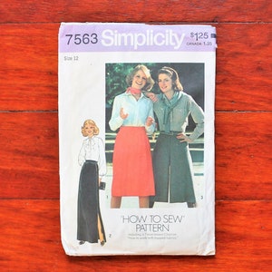 May include: Vintage Simplicity sewing pattern number 7563, size 12, for a skirt with a slit and a skirt with a waistband. The pattern includes instructions on how to sew the skirts. The pattern is on a white background with pink and purple text.