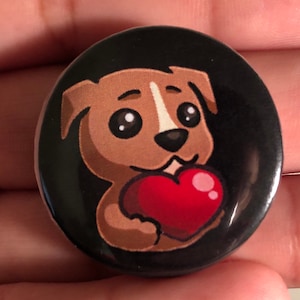 May include: A brown and white cartoon dog holding a red heart. The dog has big eyes and a happy expression. The background is black.