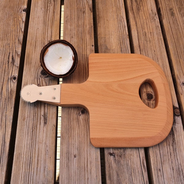 Coconut hand grater or scraper on wooden board. Stainless steel grater, coconut milk.Traditional style Filipino / Thai. Kudkuran. Kayuran .