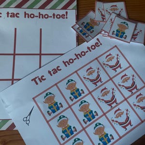 May include: A printable tic-tac-toe game with a Christmas theme. The game board features a red and green striped border and the words "Tic tac ho-ho-toe!" The game pieces are images of elves wearing Santa hats and holding presents.