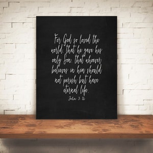 May include: Black chalkboard with white text that reads "For God so loved the world, that he gave his only Son, that whoever believes in him should not perish but have eternal life. John 3:16"