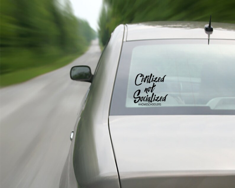 May include: A silver car with a black decal on the back window that reads "Civilized not Socialized #HOMESCHOOLERS".
