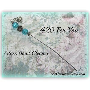 May include: A glass bowl cleaner with a long, thin metal handle and blue glass beads. The handle is decorated with a small, metal sun charm. The text "420 For You" and "Glass Bowl Cleaner" are visible in the image. The text "420foryou@etsy.com" is also visible in the image.