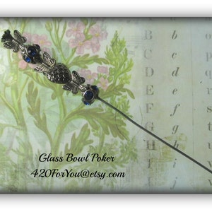May include: A silver glass bowl poker with blue glass accents and a floral pattern background. The text "Glass Bowl Poker" and "420ForYou@etsy.com" is visible in the image.