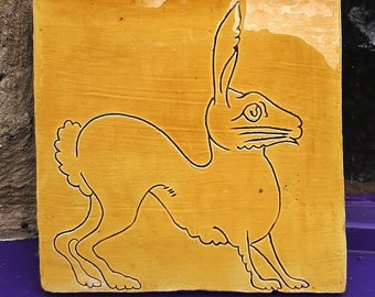 Hand made golden hare, terracotta tile