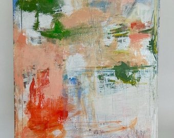 May include: Abstract painting on canvas with a white background and a mix of colors. The artwork features strokes of orange, green, pink, and blue. The painting is mounted on a white easel.