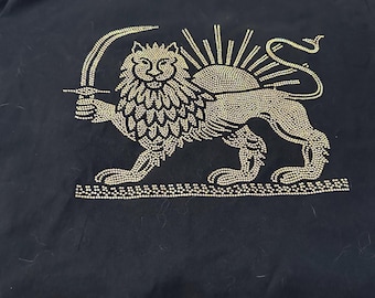 Black T-shirt featuring a gold rhinestone Lion & Sun design — a timeless symbol of Iranian heritage, strength, and pride