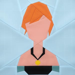 May include: A geometric quilt block featuring a stylized female figure. The design uses orange, peach, black, yellow, and light blue fabric pieces. The figure has orange hair, a peach face, and a black necklace with a yellow pendant.