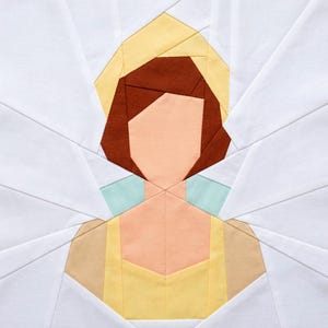 May include: A geometric quilt block featuring a stylized portrait of a person. The design uses various fabric colors, including peach, brown, yellow, and light blue, set against a white background. The block is square and appears to be handmade.