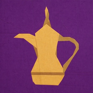 May include: A geometric illustration of a gold-colored coffee pot against a purple background. The pot has a long spout, a curved handle, and a pointed lid. The design is composed of angular shapes and lines, creating a modern, abstract aesthetic.