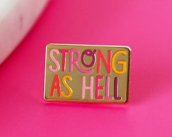 ON SALE: Strong As Hell Gold Enamel Pin