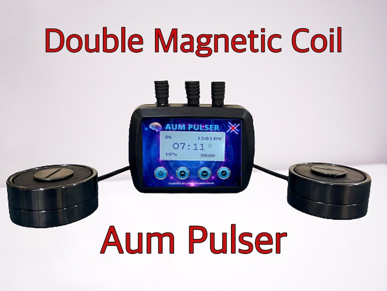 May include: A black device with a digital display that reads "AUM PULSER" and shows the time as 12:03 PM. The device is connected to two black circular magnetic coils.