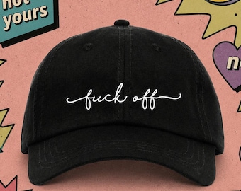 May include: Black baseball cap with the phrase "fuck off" in white script. The background features a smiley face, a heart with the word "no", and other colorful graphic elements. The overall theme is a humorous, edgy style.