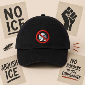 May include: Black baseball cap with a red and blue embroidered design of a crossed-out ice cube. The cap is surrounded by signs that read "NO ICE", "ABOLISH ICE", and "NO BORDERS IN OUR COMMUNITIES".
