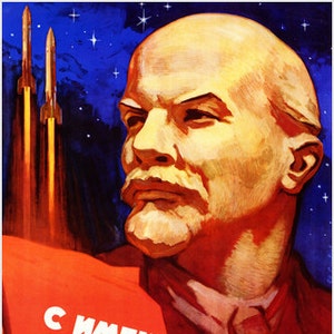 May include: A vintage Soviet propaganda poster featuring a portrait of Vladimir Lenin with a red banner that reads "С именем Ленина!" (With the name of Lenin!). The poster also depicts three rockets launching into space against a starry blue background.