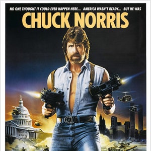 May include: A movie poster for the action film "Invasion U.S.A." starring Chuck Norris. The poster features a dramatic image of Chuck Norris holding two guns, with the U.S. Capitol building and a cityscape in the background. The text on the poster reads "No one thought it could ever happen here... America wasn't ready... But he was. Chuck Norris. Invasion U.S.A."