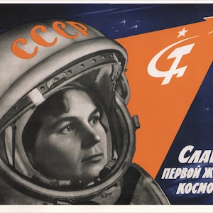 May include: A vintage Soviet propaganda poster featuring a woman in a space helmet, with the text "СЛАВА ПЕРВОЙ ЖЕНЩИНЕ-КОСМОНАВТУ!" (Glory to the first woman cosmonaut!) and the emblem of the USSR. The poster is set against a blue and orange background with stars.