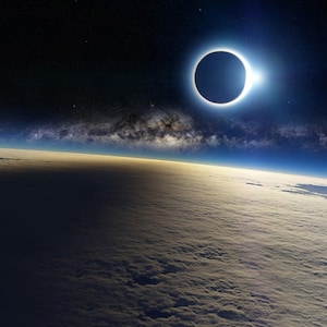 May include: A total solar eclipse seen from space, with the sun's corona visible as a bright ring around the moon. The Earth's atmosphere is visible in the background, with clouds and a blue sky.