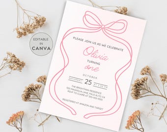 May include: A pink and white invitation card featuring a bow and ribbon design. The text reads "Please join us as we celebrate Olivia turning one" with the date, time, and location details. The card is editable in Canva.