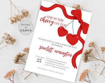 May include: A white baby shower invitation with red text and a red ribbon with cherries. The text reads "She is the cherry on top" and "Please join us for a baby shower honouring Scarlett Remington". The date is 25th October.