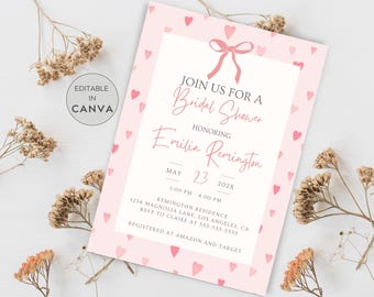 May include: Pink bridal shower invitation with a white border and pink hearts. The invitation reads "Join us for a Bridal Shower Honoring Emilia Remington May 23, 202X 1:00 PM 4:00 PM Remington Residence 1234 Magnolia Lane, Los Angeles, CA RSVP to Claire at 555-555-5555 Registered at Amazon and Target"