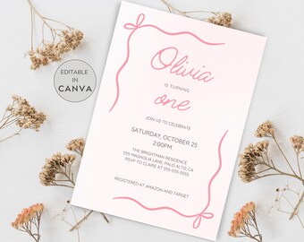 May include: A pink and white invitation card with the text "Olivia is turning one." The card has a pink ribbon design around the edges and includes event details such as the date, time, and location. The words "Editable in Canva" are also present.
