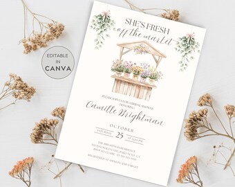 May include: A watercolour illustration of a flower stall with the text "She's Fresh off the Market" above it. The invitation is for a bridal shower honouring Camille Brightman on 25th October at 2:00 PM. The event will be held at the Brightman Residence, 535 Magnolia Lane, Palo Alto, CA. RSVP to Claire at 335-595-5555. The couple are registered at Amazon and Target.