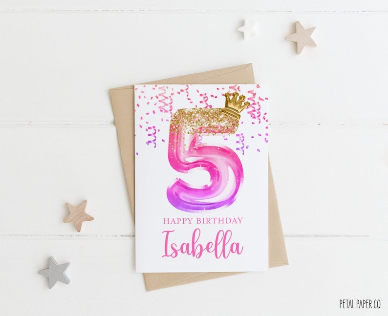 May include: A pink and purple watercolour number five with gold glitter and a gold crown on top. The card says "Happy Birthday Isabella" and is surrounded by confetti.