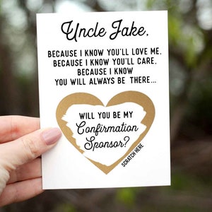 May include: A white card with gold heart-shaped scratch-off area. The card reads "Uncle Jake. BECAUSE I KNOW YOU'LL LOVE ME. BECAUSE I KNOW YOU'LL CARE. BECAUSE I KNOW YOU WILL ALWAYS BE THERE... WILL YOU BE MY Confirmation Sponsor? SCRATCH HERE".