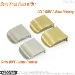 May include: Two pairs of cabinet pulls in gold and silver. The pulls are made of metal and have a matte finish. The text "GOLD DOFF / Matte Finishing" and "Silver DOFF / Matte Finishing" is visible in the image.