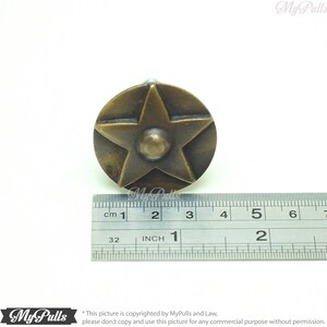 Rustic brass star knobs for farmhouse cabinet