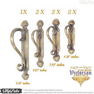 May include: Four solid brass Victorian door handles with a decorative design. The handles are 4.56 inches, 5.90 inches, 6.65 inches, and 9.00 inches long.