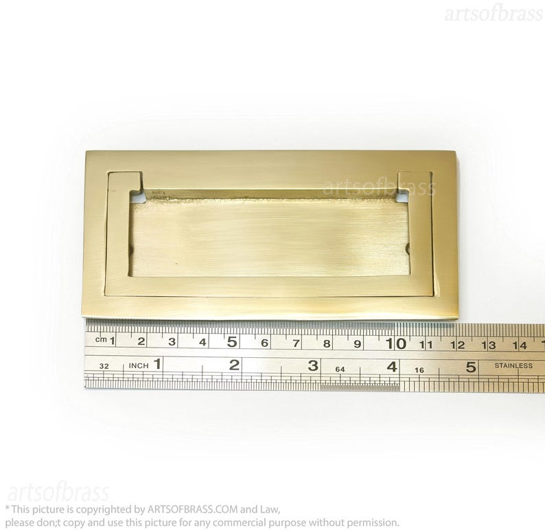 Polished gold solid brass rectangular flush door handle close up