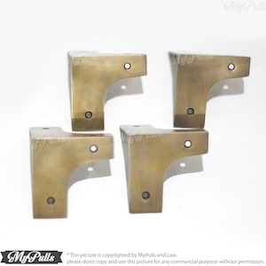 Vintage style gold brass corner protectors close up