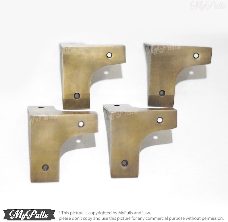 Vintage style gold brass corner protectors close up