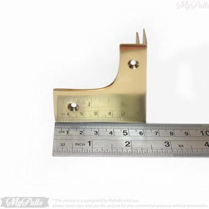 Gold brass corner protectors for cabinet edges