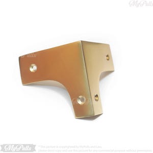 Gold finish brass corner protectors close up detail