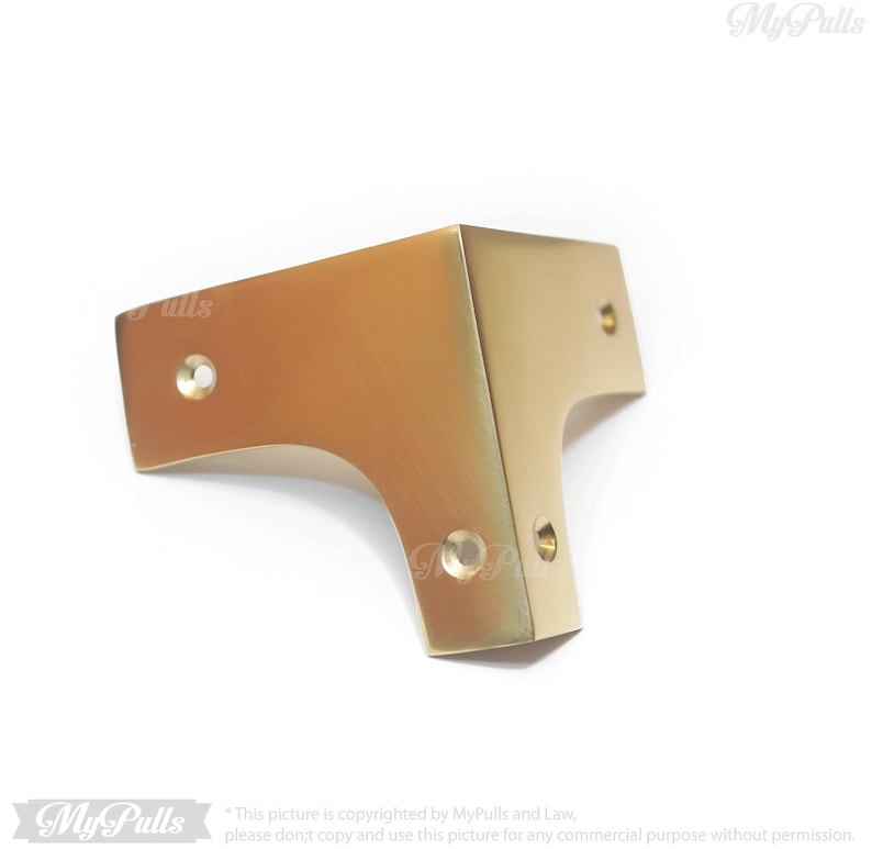 Gold finish brass corner protectors close up detail