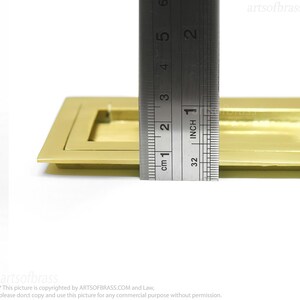 Rectangular flush mounted brass handle for sliding barn doors