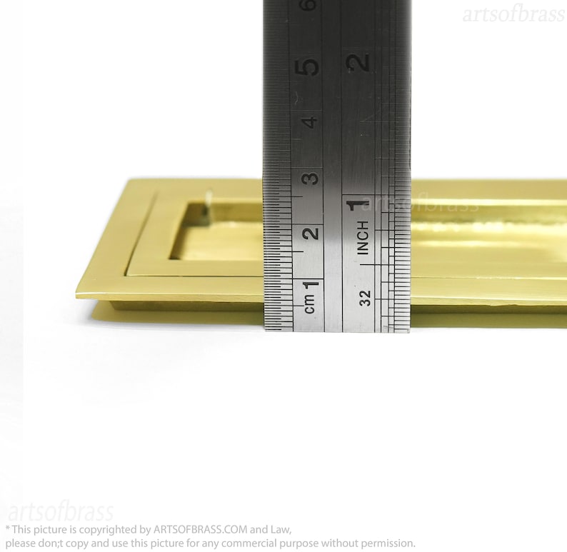 Rectangular flush mounted brass handle for sliding barn doors