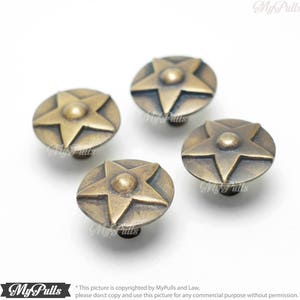 Close-up of solid brass Texas star drawer pulls