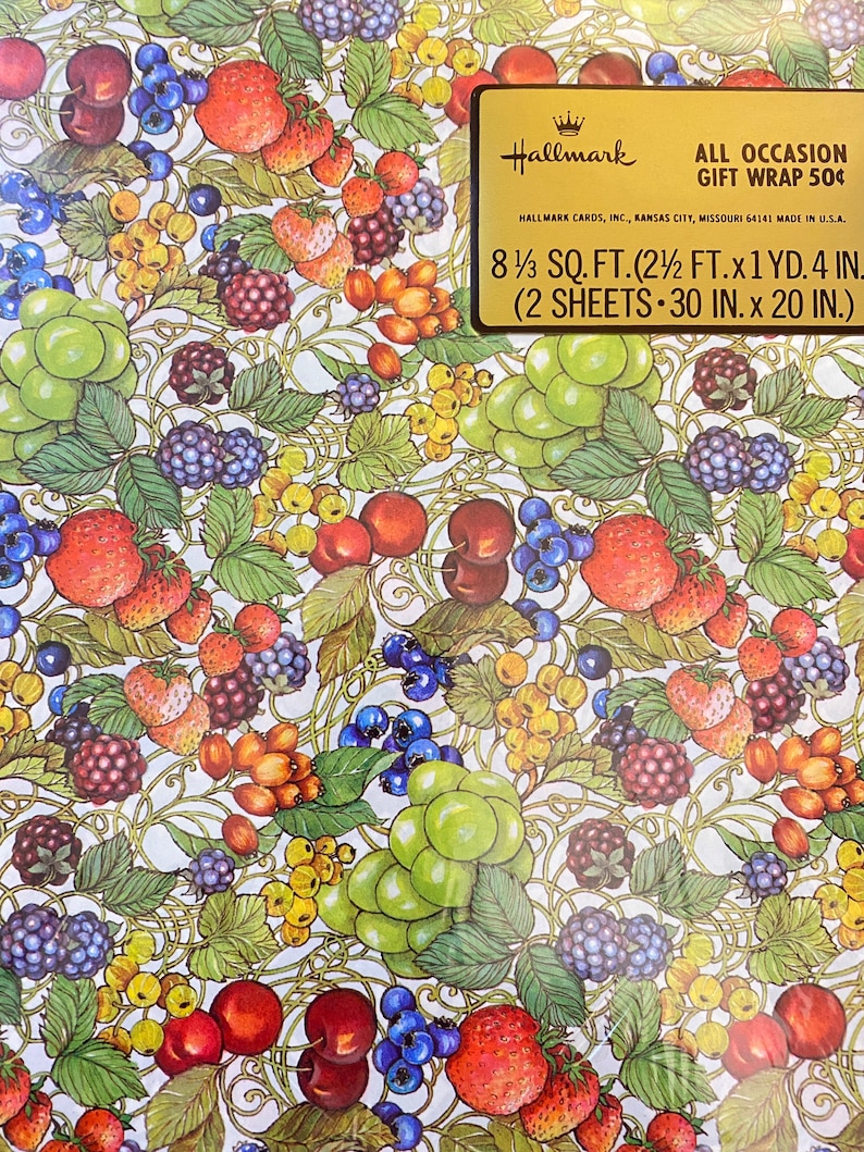 May include: A sheet of Hallmark gift wrap featuring a colorful pattern of various fruits, including strawberries, cherries, grapes, and blackberries. The wrap is designed for all occasions and measures 8 1/3 square feet (2 1/2 feet by 1 yard, 4 inches). It includes two sheets, each measuring 30 inches by 20 inches.