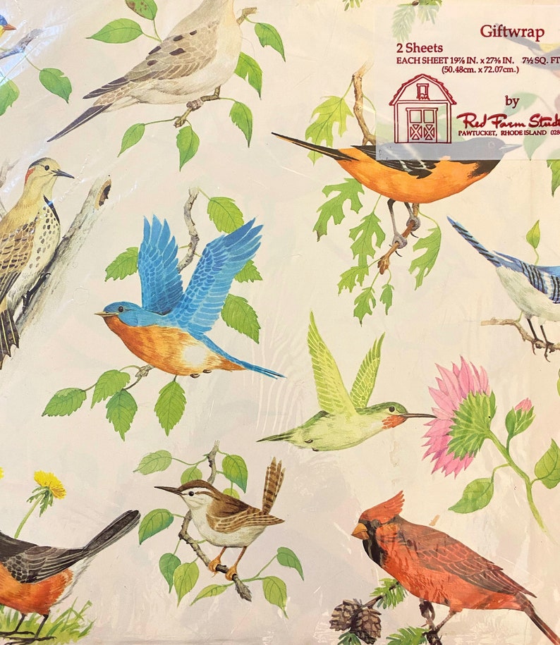 May include: Gift wrap featuring a colourful pattern of birds and flowers on a white background. The text "Giftwrap" is printed in the top right corner, along with the brand name "Red Farm Studio" and the location "Pawtucket, Rhode Island 02861".