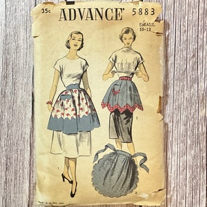 May include: Vintage sewing pattern for two aprons, Advance pattern number 5883, size small 10-12. The pattern shows two women wearing the aprons, one with a red and white floral print and the other with a blue and white polka dot print.