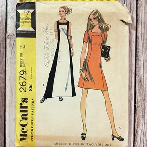 Könnte beinhalten: Vintage McCall's Schnittmuster für ein Kleid in zwei Ausführungen. Die Musternummer ist 2679 und der Preis beträgt 85 Cent. Das Muster ist für Damen in den Größen 14 und 16.