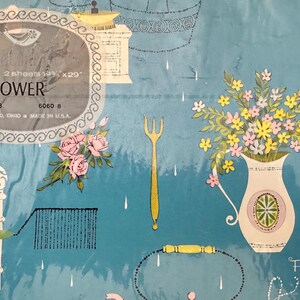 May include: Blue and white shower gift wrap with a floral design, a pitcher, a fork, and the text "Shower" and "For Your Shower".