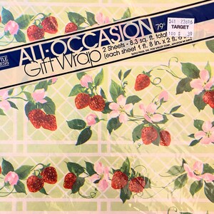 May include: A green and white patterned gift wrap with a strawberry design. The wrap is labelled "All Occasion Gift Wrap" and has a price tag that says "79 pence" and "Target".