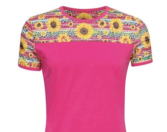 May include: A pink short-sleeved t-shirt with a colorful sunflower and leopard print design on the top half of the shirt.