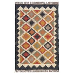 May include: A rectangular jute rug with a geometric pattern of black, red, orange, yellow, green, and beige diamonds. The rug has a black border with a fringe.