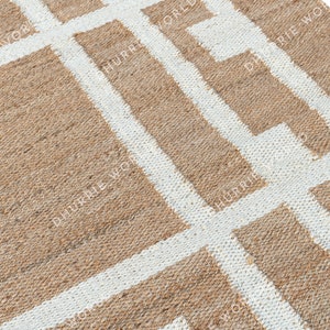 May include: A natural fiber rug with a geometric pattern of white lines on a brown background.